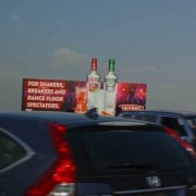 Leverage premier advertising placements by placing large billboard signs in